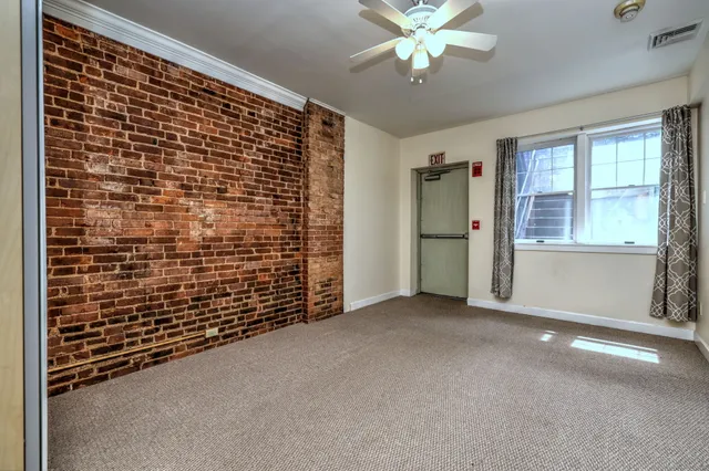 a view of empty room with a ceiling fan