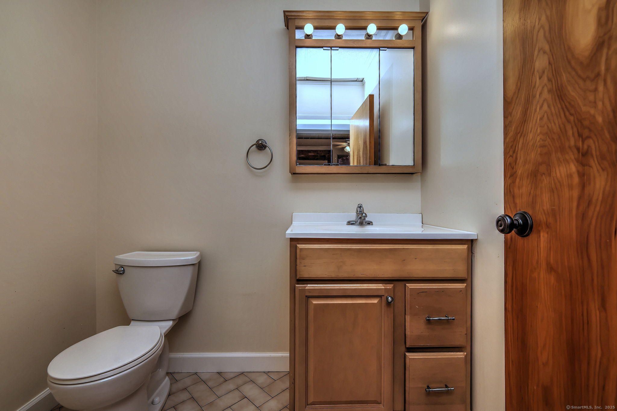 844 Grand Avenue, Unit 2 New Haven, CT 06511 - Photo 33 of 36 a bathroom with a toilet a sink and mirror