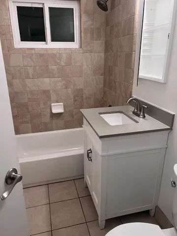 a bathroom with a sink and mirror