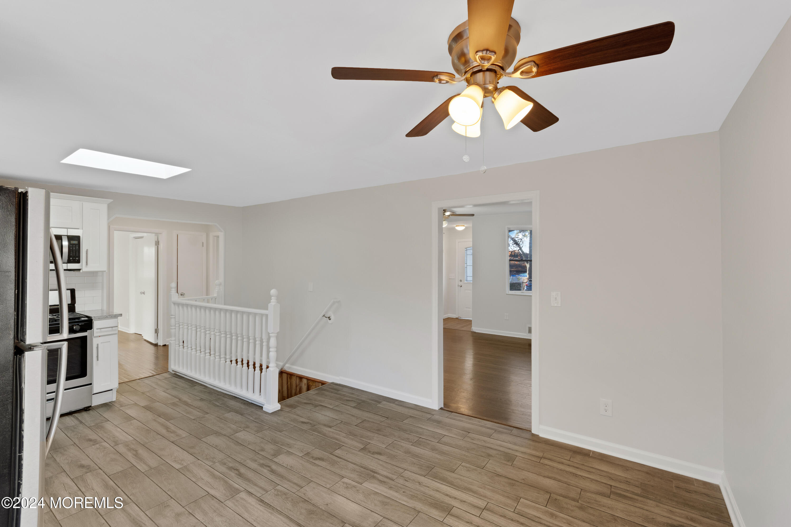 1718 Forge Pond Road Brick, NJ 08724 - Photo 11 of 29 a view of empty room with wooden floor and ceiling fan