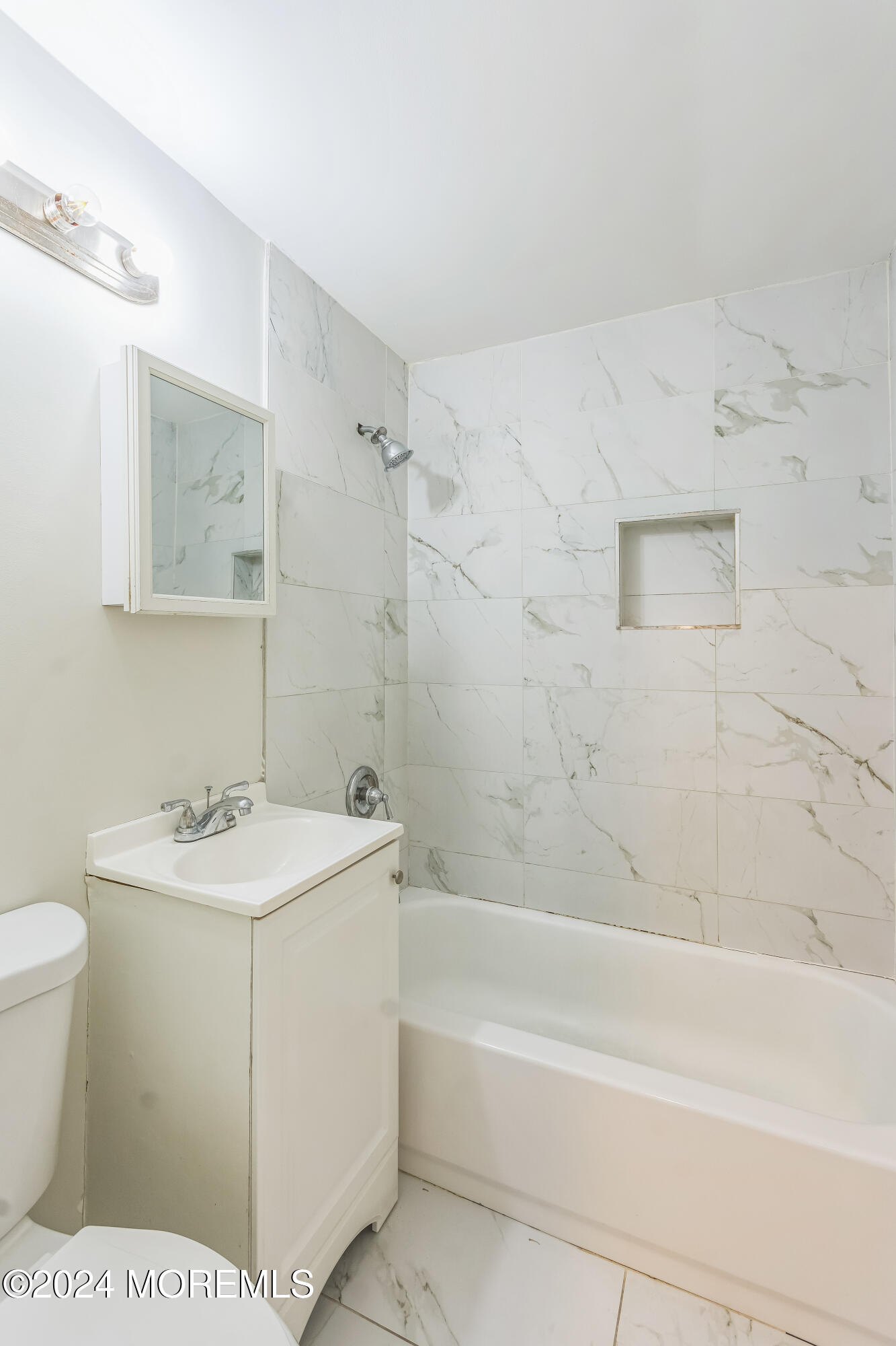 1718 Forge Pond Road Brick, NJ 08724 - Photo 12 of 29 a bathroom with a sink a toilet and shower