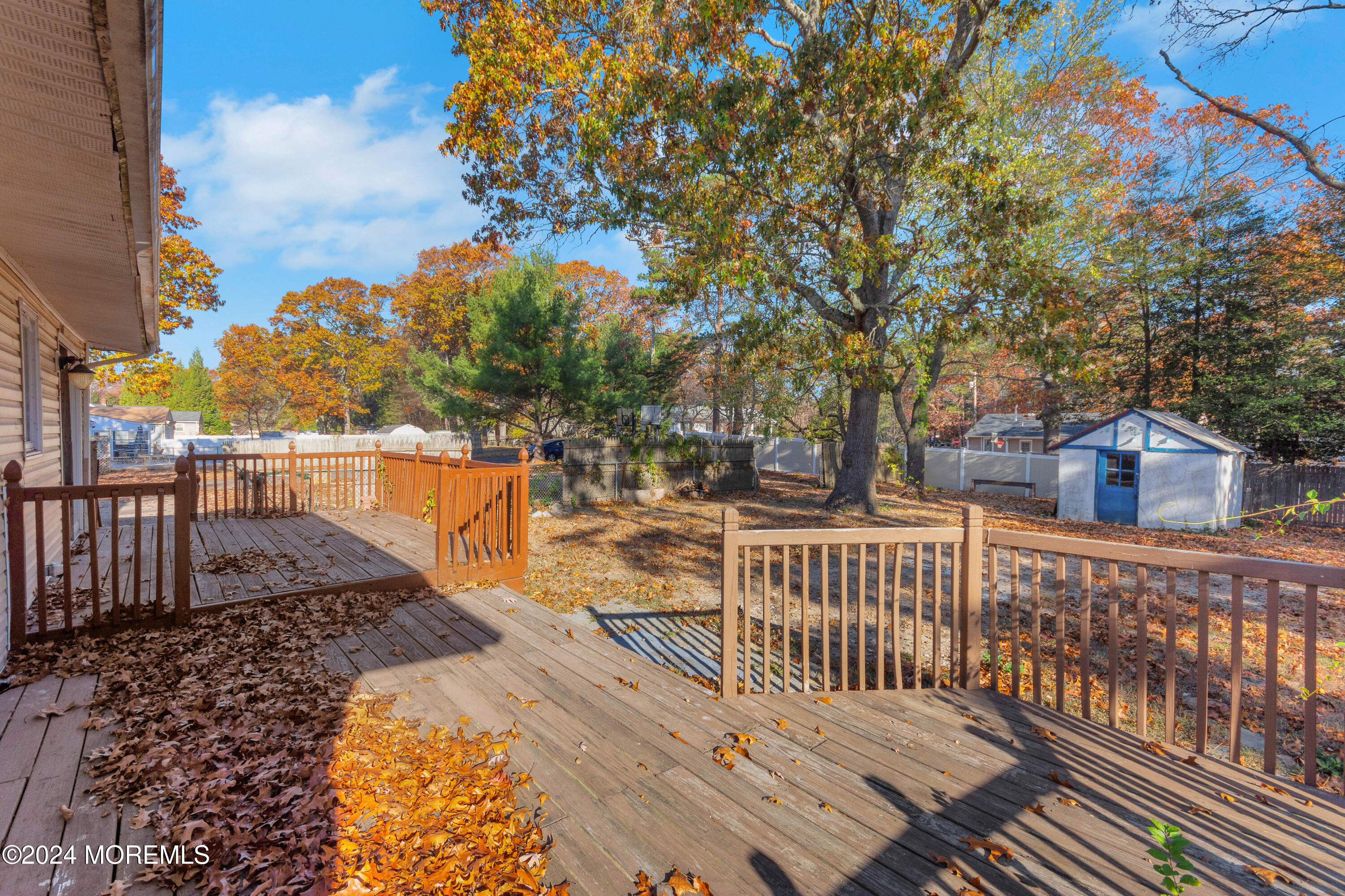 1718 Forge Pond Road Brick, NJ 08724 - Photo 17 of 29 a view of a roof deck with wooden floor and fence