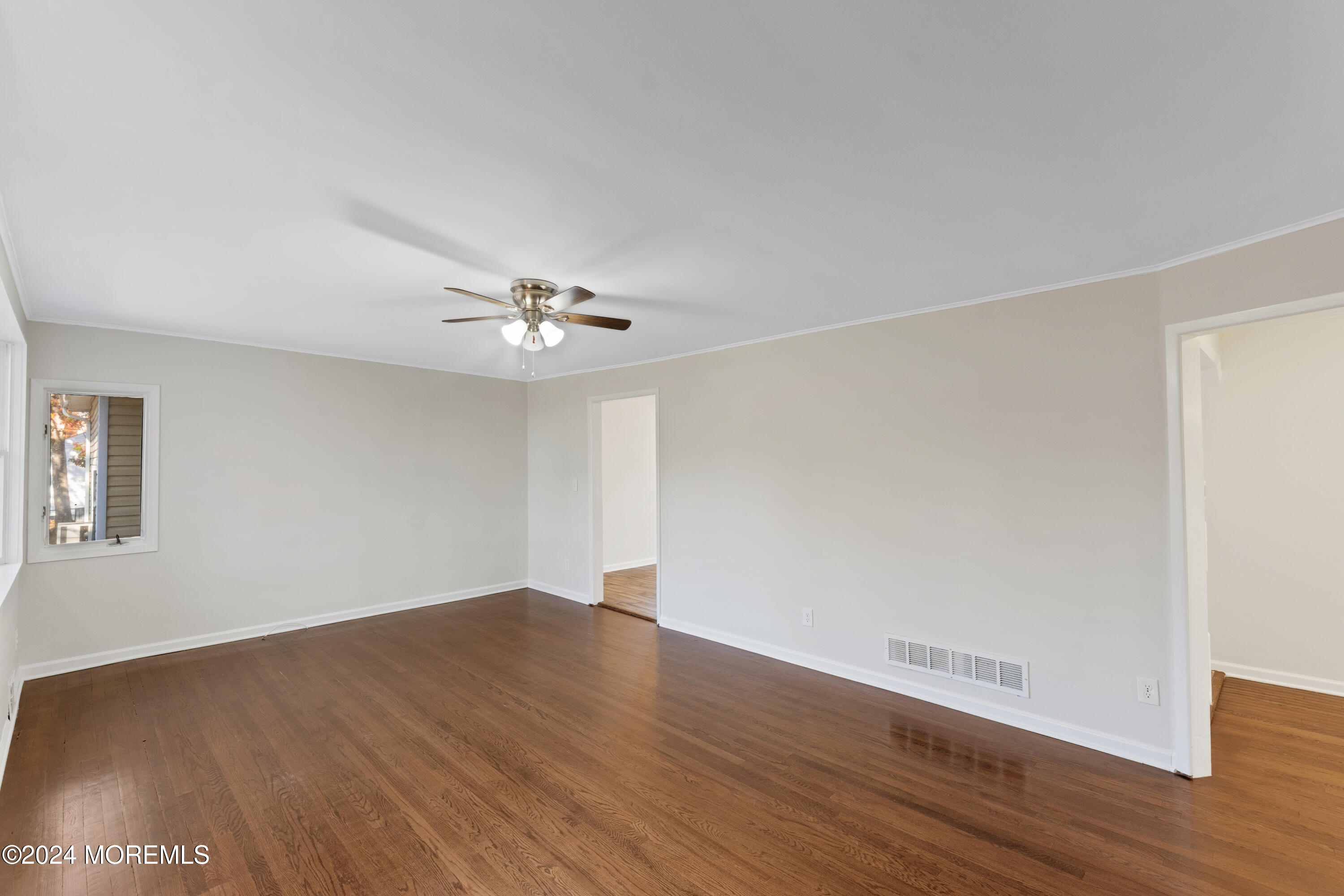 1718 Forge Pond Road Brick, NJ 08724 - Photo 21 of 29 a view of an empty room with wooden floor