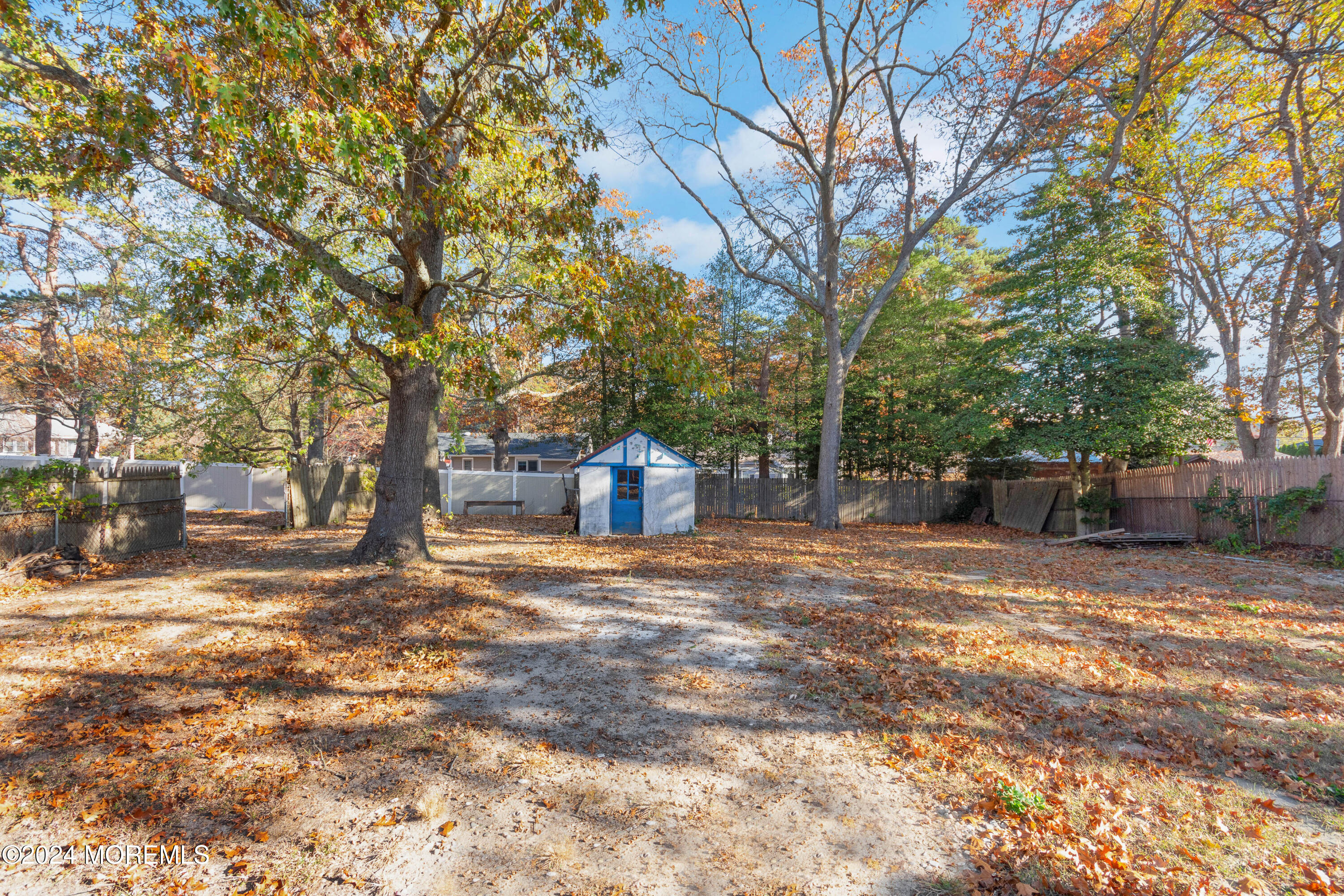 1718 Forge Pond Road Brick, NJ 08724 - Photo 22 of 29 a house with trees in front of it