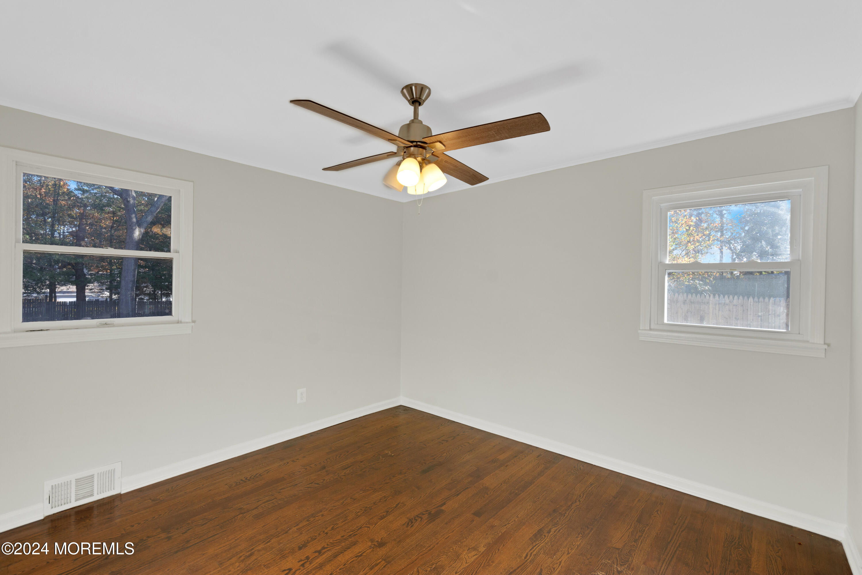 1718 Forge Pond Road Brick, NJ 08724 - Photo 23 of 29 a view of an empty room with window and a ceiling fan