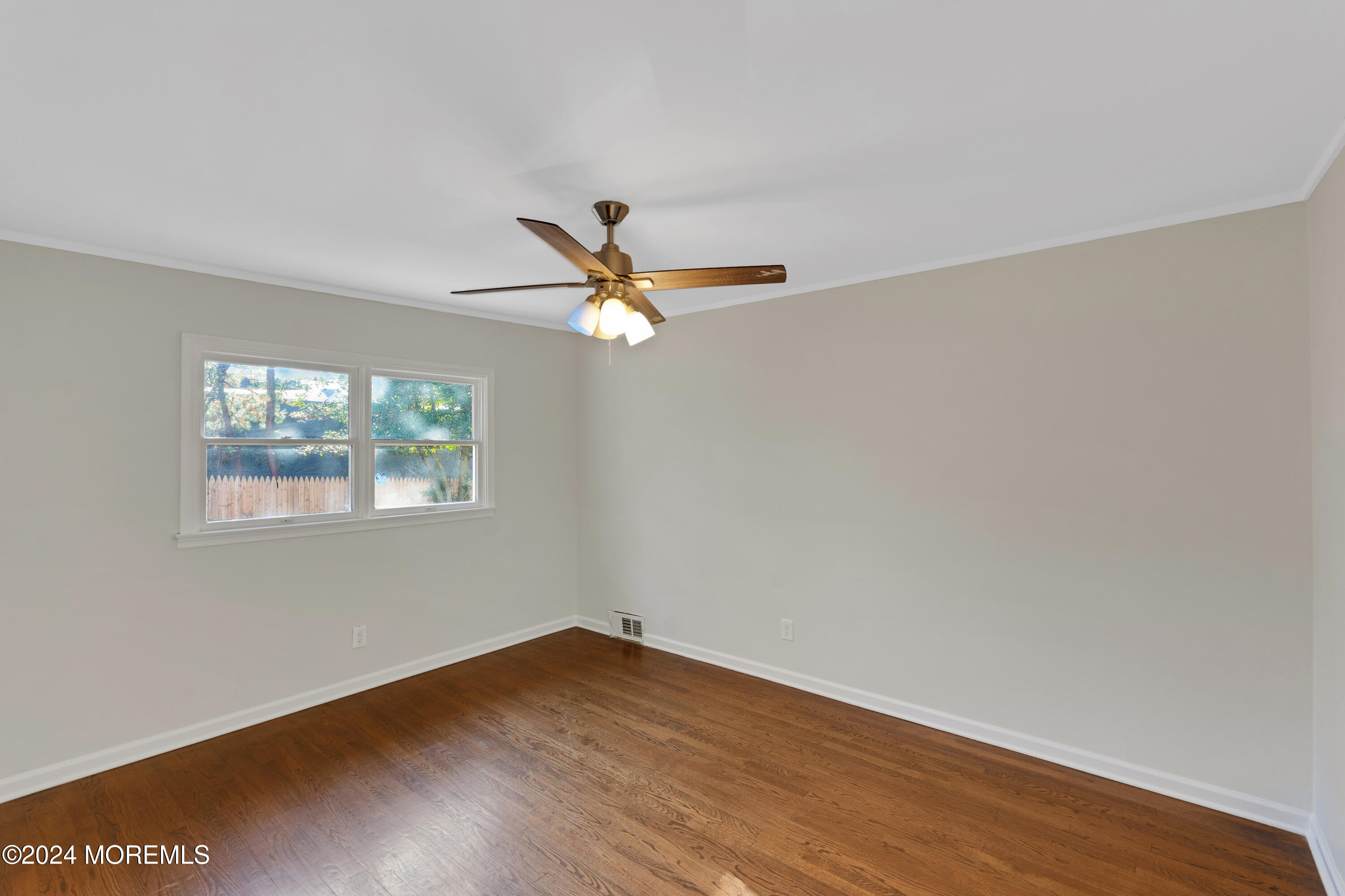 1718 Forge Pond Road Brick, NJ 08724 - Photo 24 of 29 a view of a room with wooden floor fan and windows
