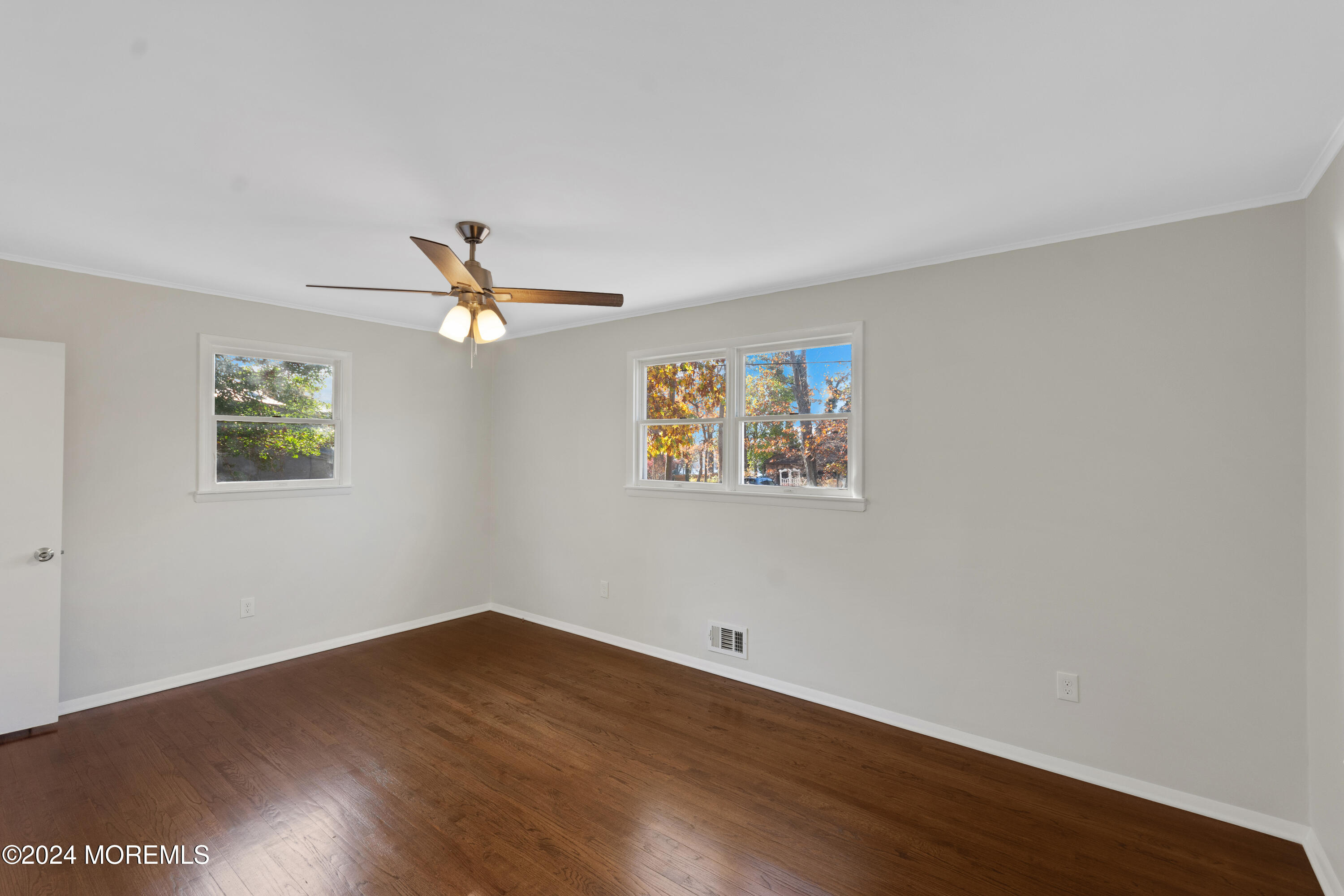1718 Forge Pond Road Brick, NJ 08724 - Photo 26 of 29 a view of a big room with wooden floor and windows