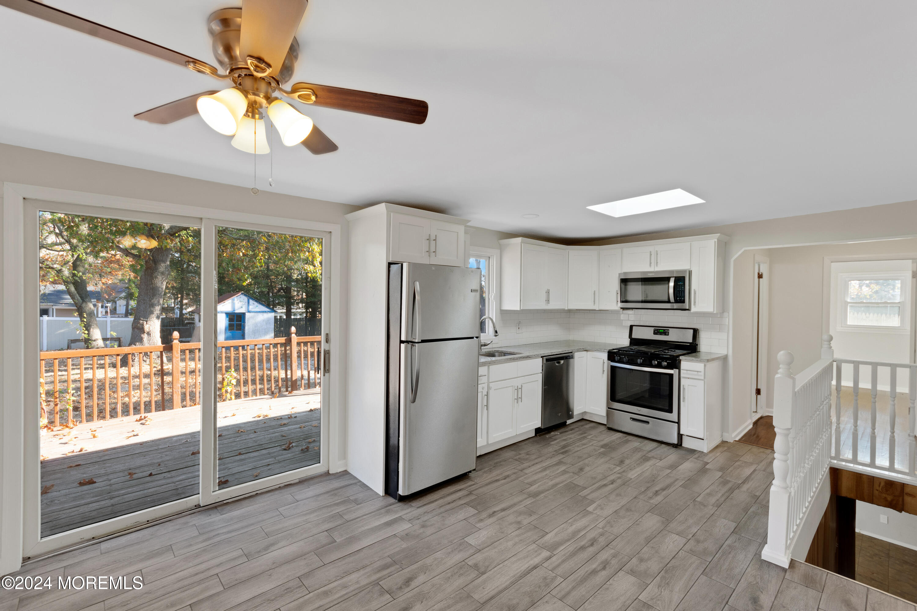 1718 Forge Pond Road Brick, NJ 08724 - Photo 8 of 29 a kitchen with stainless steel appliances a stove a refrigerator and a view of living room