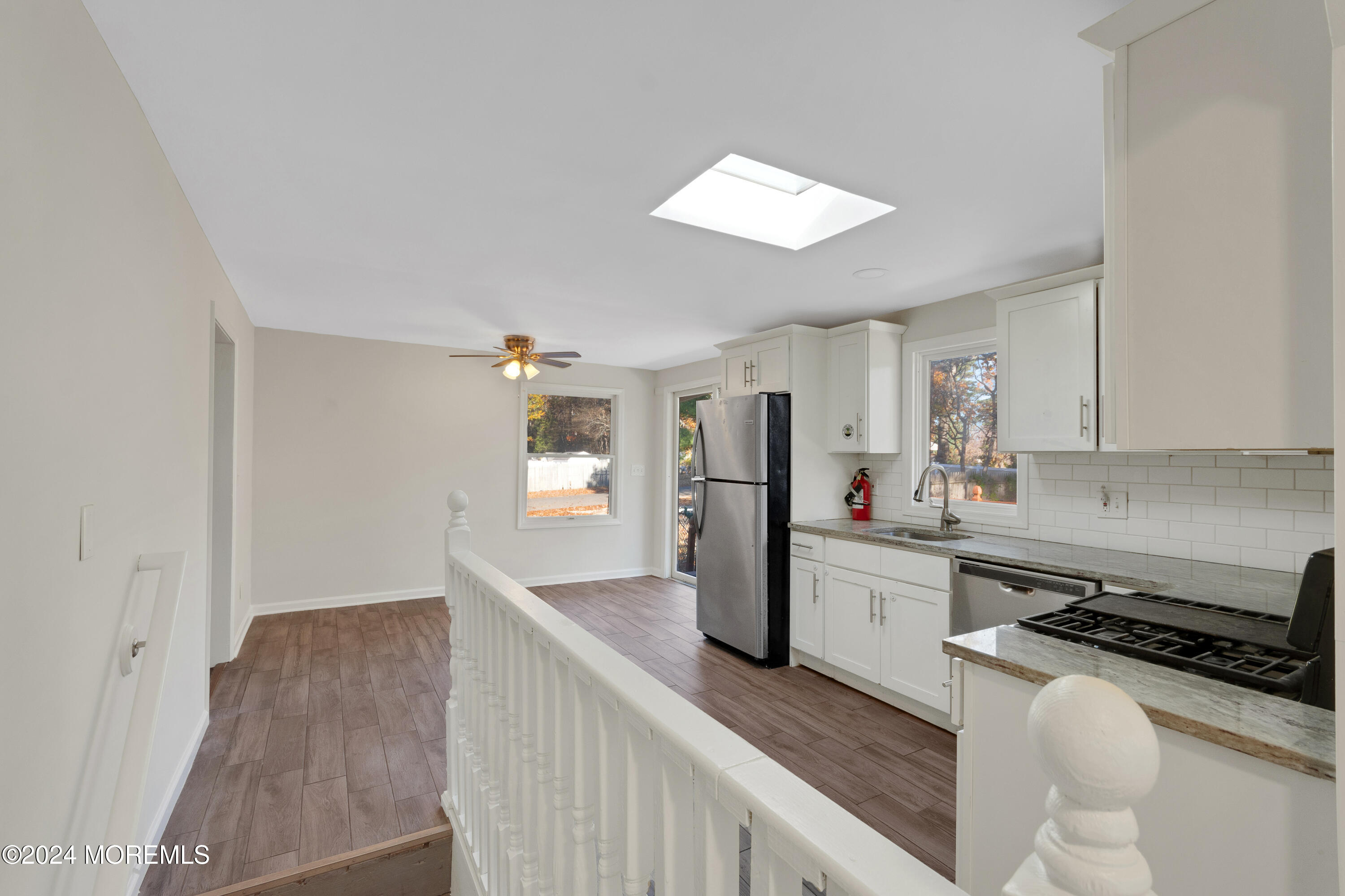 1718 Forge Pond Road Brick, NJ 08724 - Photo 10 of 29 a kitchen with sink cabinets and window