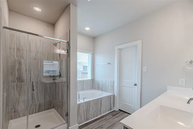 a en suite bathroom with a sink and mirror