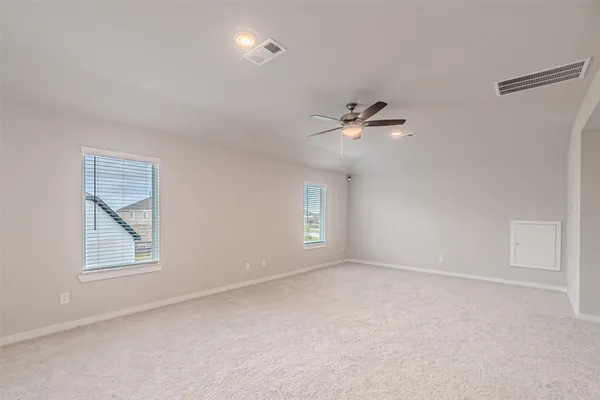 a view of an empty room with a window