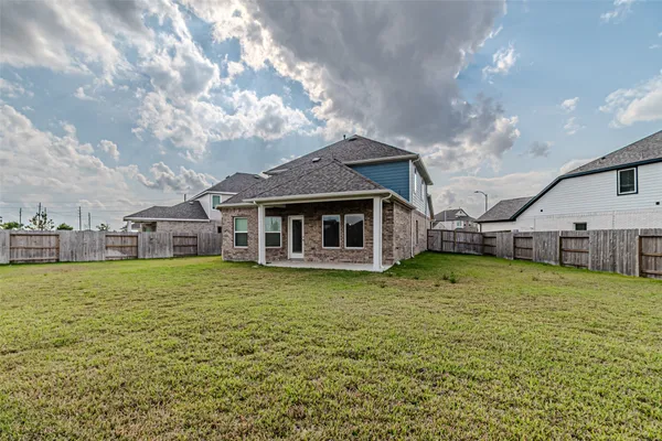 a house with swimming pool in front of it