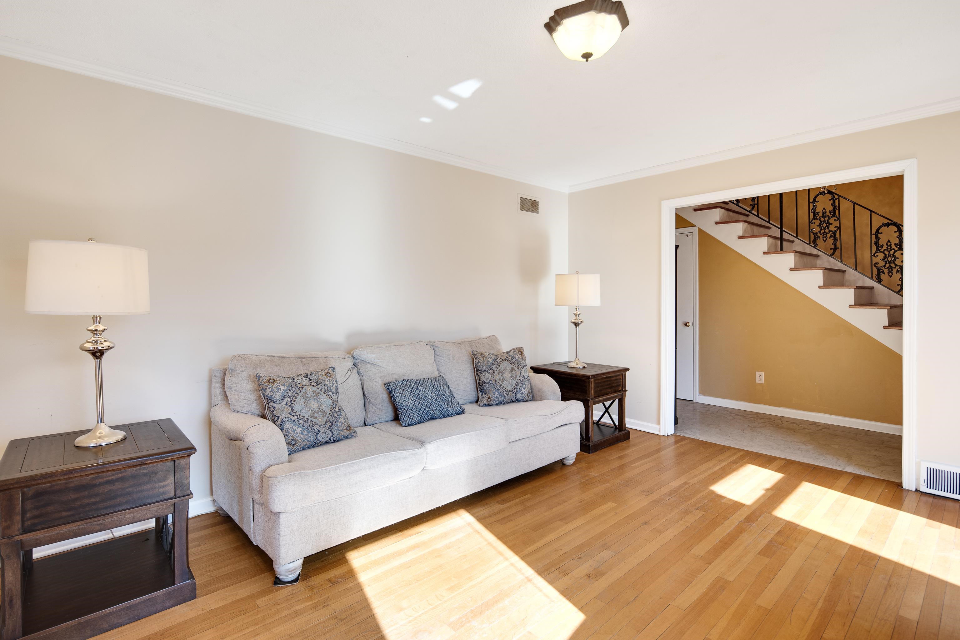 6152 Quince Road Memphis, TN 38119 - Photo 8 of 28 Living room with hardwood / wood-style flooring and crown molding
