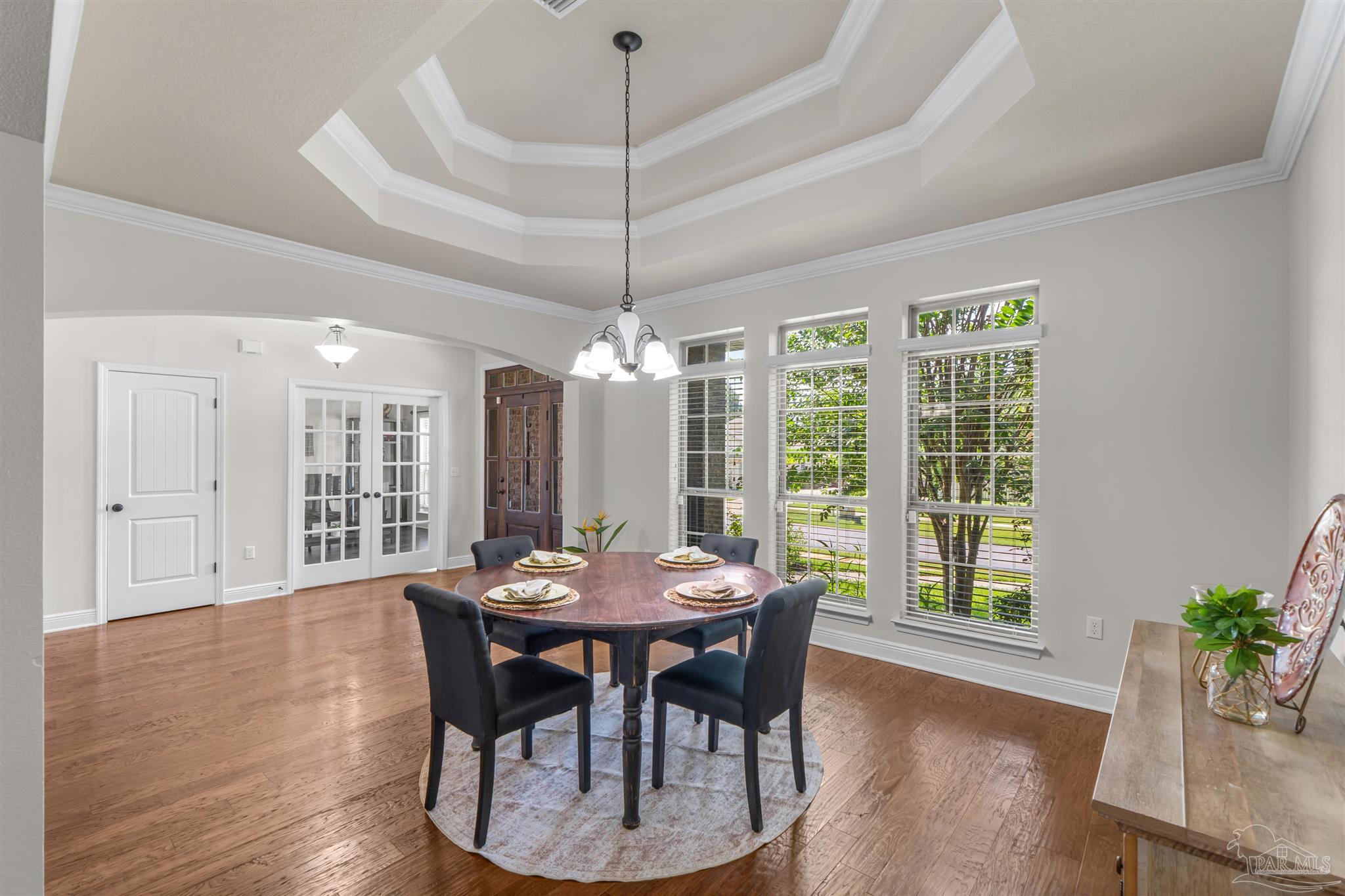 2698 Tulip Hill Road Pace, FL 32571 - Photo 5 of 65 a view of a dining room with furniture window and wooden floor