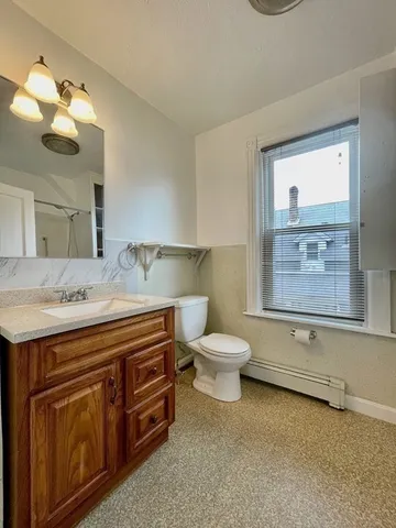 a bathroom with a tub and a shower