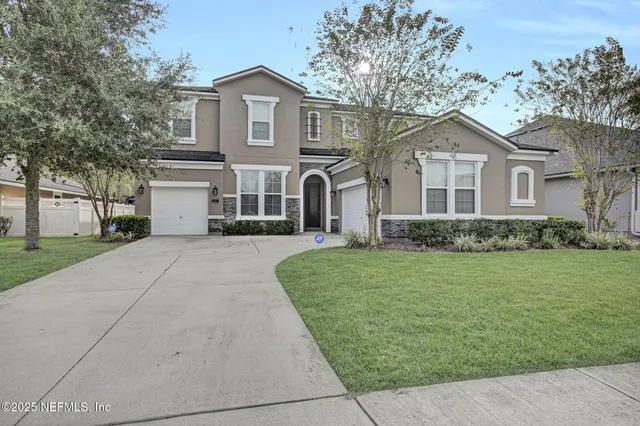 front view of a house with a yard