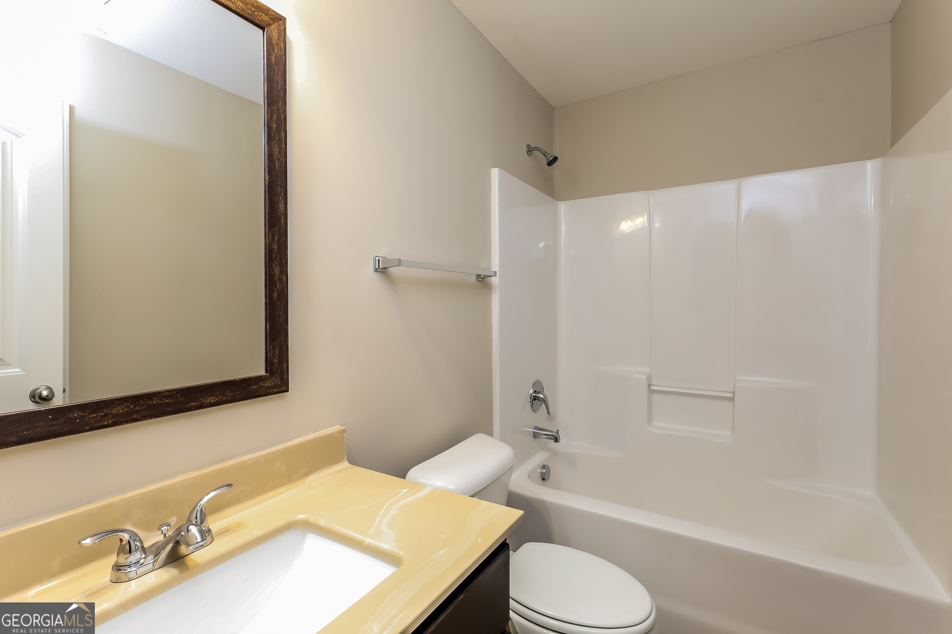 2518 Quincy Loop, Unit 90 Fairburn, GA 30213 - Photo 14 of 15 a bathroom with a sink toilet and shower