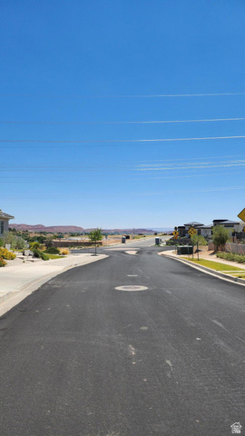 231 Colbey Loop Santa Clara, UT 84765 - Photo 3 of 4 View of asphalt road featuring sidewalks, curbs, and a residential view