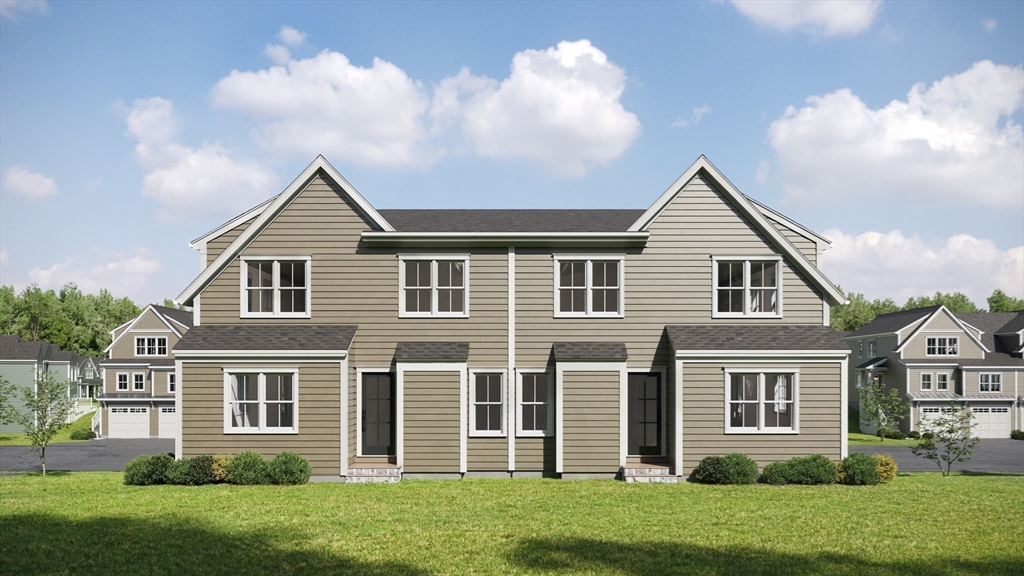 24 Pine Tree Road, Unit 24 Holden, MA 01520 - Photo 2 of 22 front view of a house with a yard