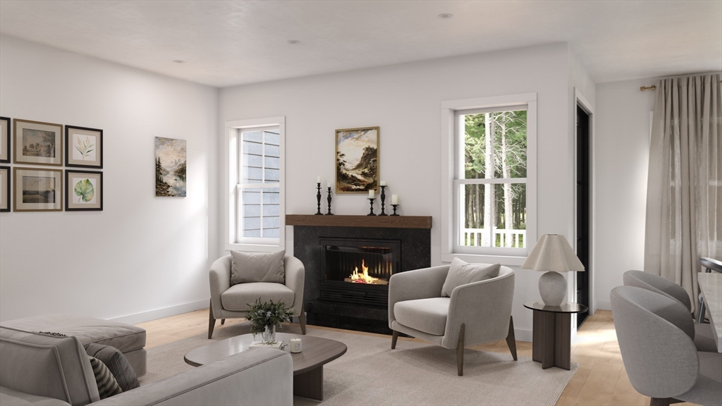 24 Pine Tree Road, Unit 24 Holden, MA 01520 - Photo 6 of 22 a living room with furniture and a fireplace