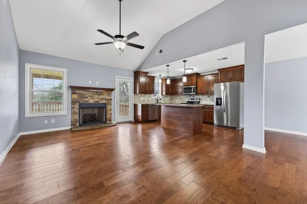 a view of kitchen with cabinets and wooden floor