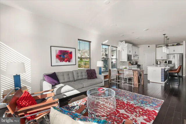a living room with furniture and a rug
