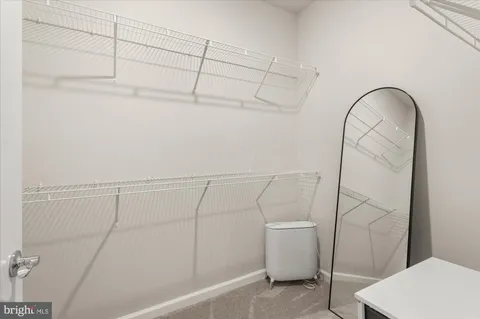 a view of a room with racks on the wall