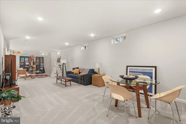 a living room with furniture and baby toys