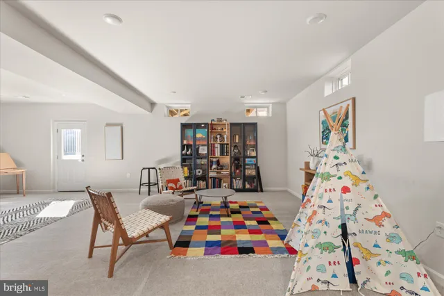 a living room with furniture and toys