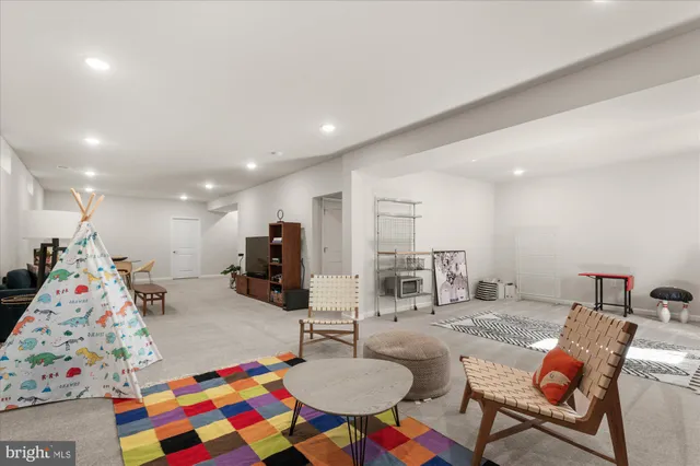 a bathroom with a granite countertop sink toilet and mirror