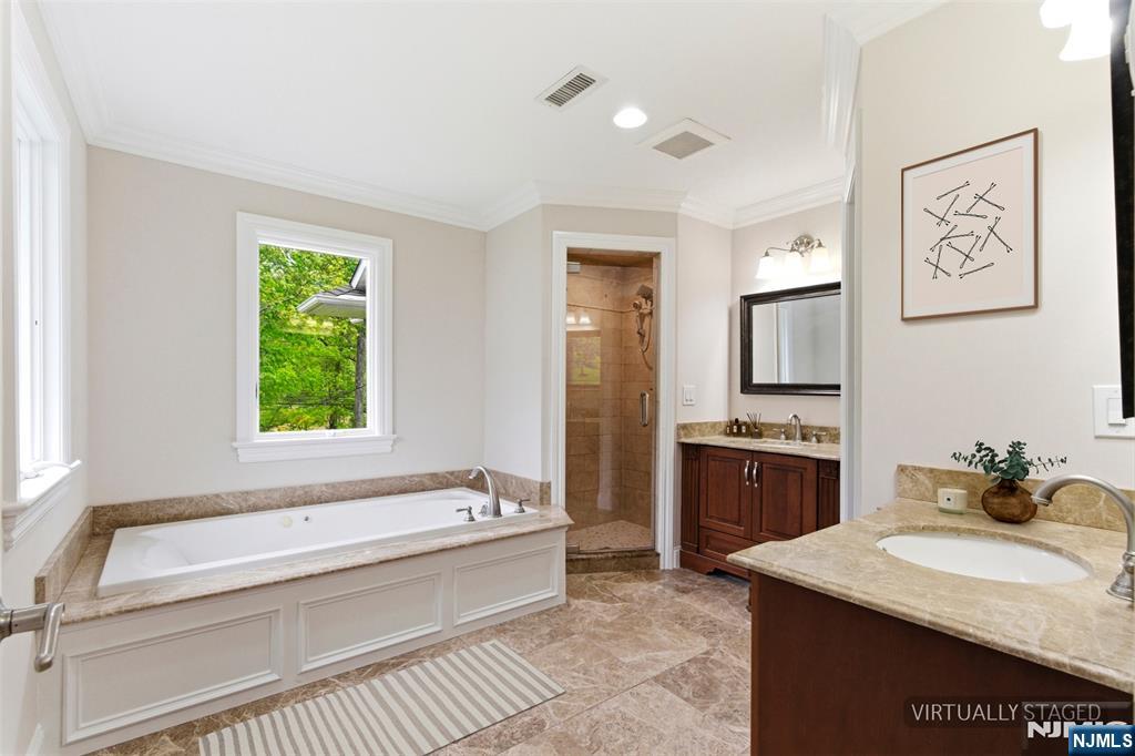 767 Orangeburgh Road River Vale, NJ 07675 - Photo 36 of 49 a spacious bathroom with a granite countertop tub sink a mirror and a bathtub