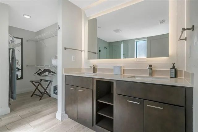 a bathroom with a sink and a mirror