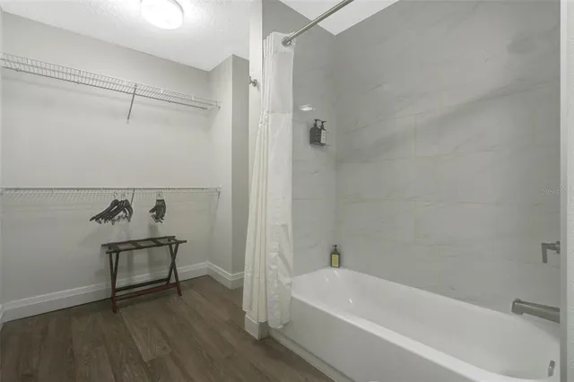 a bathroom with a bathtub and shower