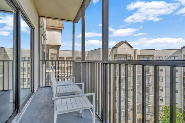 a view of a balcony with a floor to ceiling window