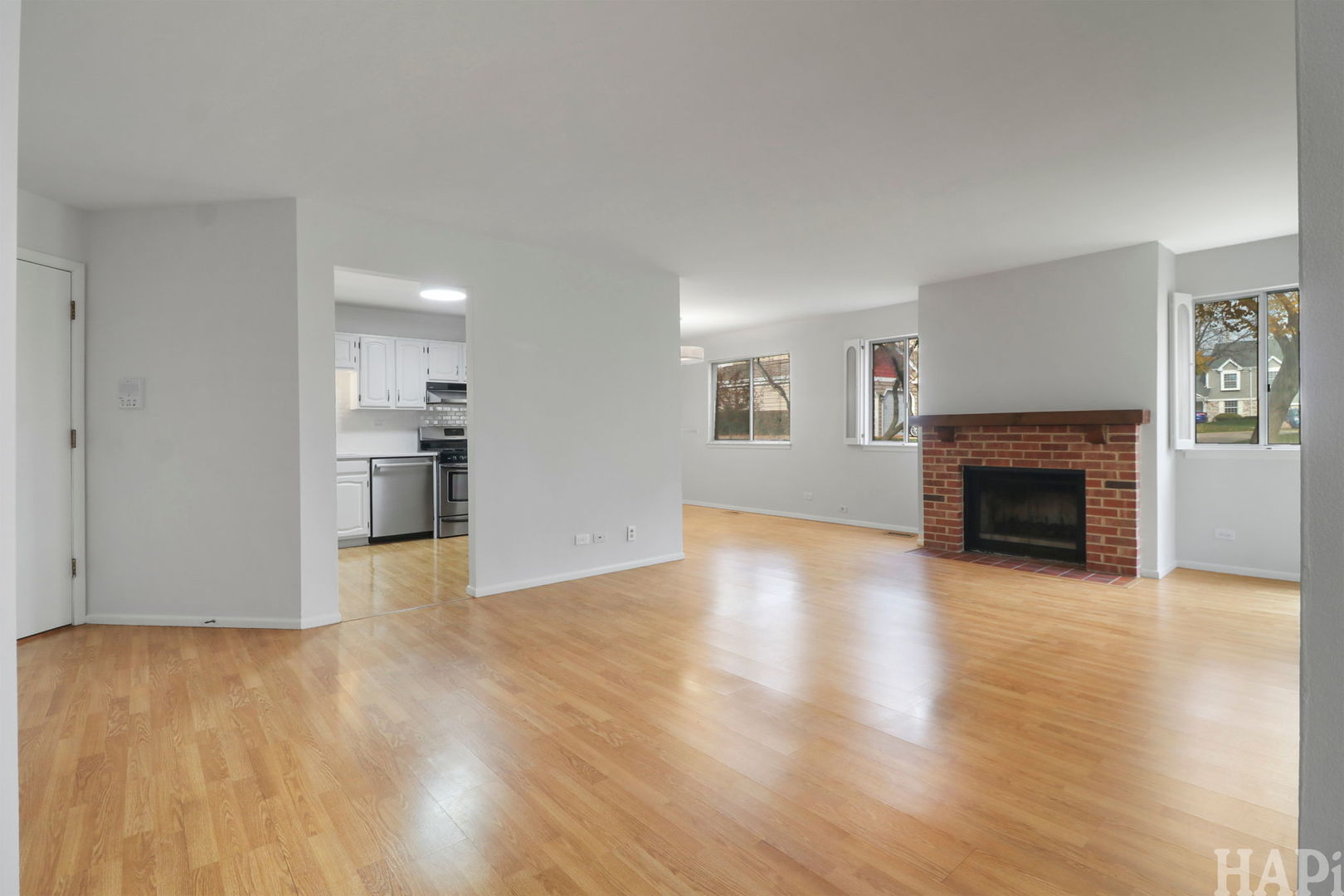602 Eastview Court, Unit Z1 Schaumburg, IL 60194 - Photo 3 of 19 a view of a livingroom with wooden floor and a fireplace