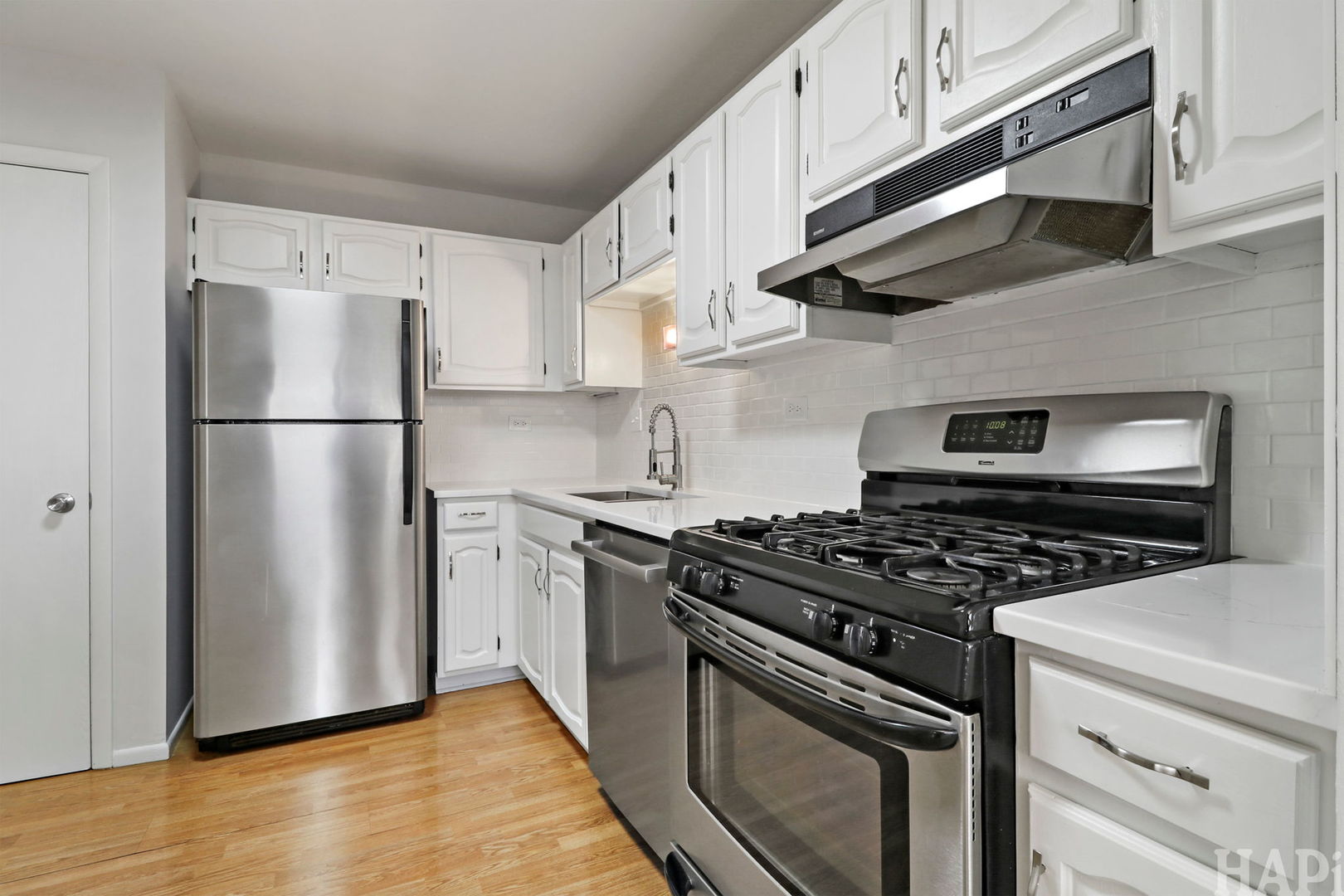 602 Eastview Court, Unit Z1 Schaumburg, IL 60194 - Photo 7 of 19 a kitchen with stainless steel appliances granite countertop a stove a refrigerator and a microwave