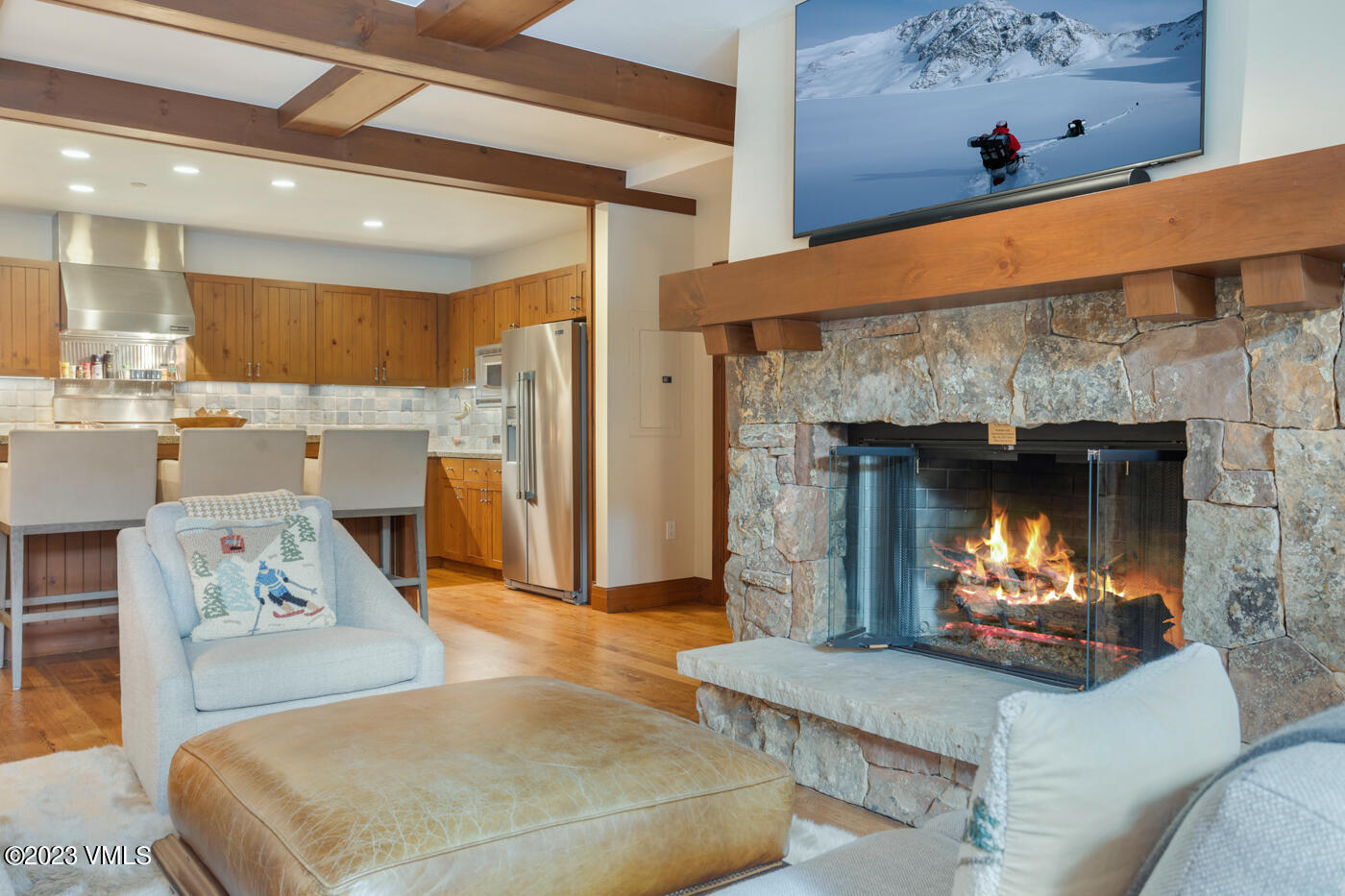 180 Daybreak Ridge Road, Unit 309 Avon, CO 81620 - Photo 11 of 27 a living room with furniture and a fireplace