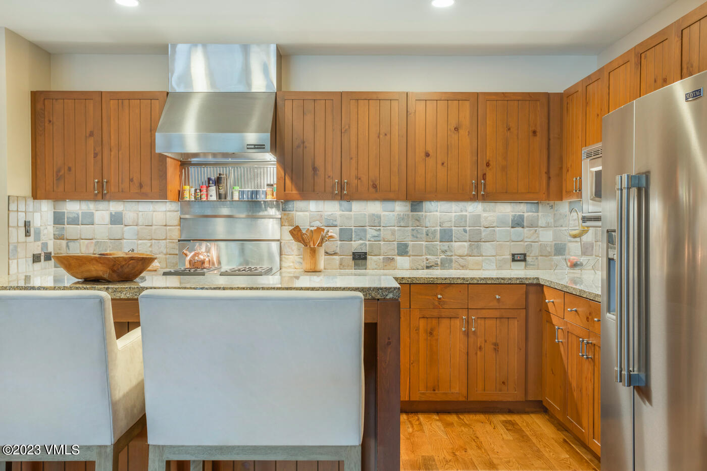 180 Daybreak Ridge Road, Unit 309 Avon, CO 81620 - Photo 14 of 27 a kitchen with stainless steel appliances a refrigerator and sink