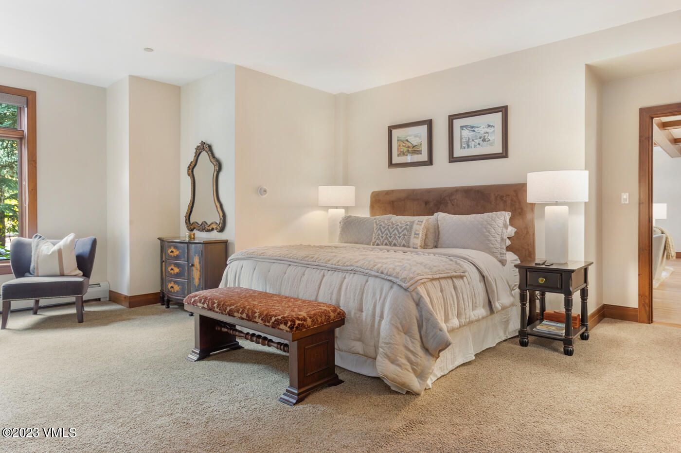 180 Daybreak Ridge Road, Unit 309 Avon, CO 81620 - Photo 17 of 27 a bed room with a bed and a chair