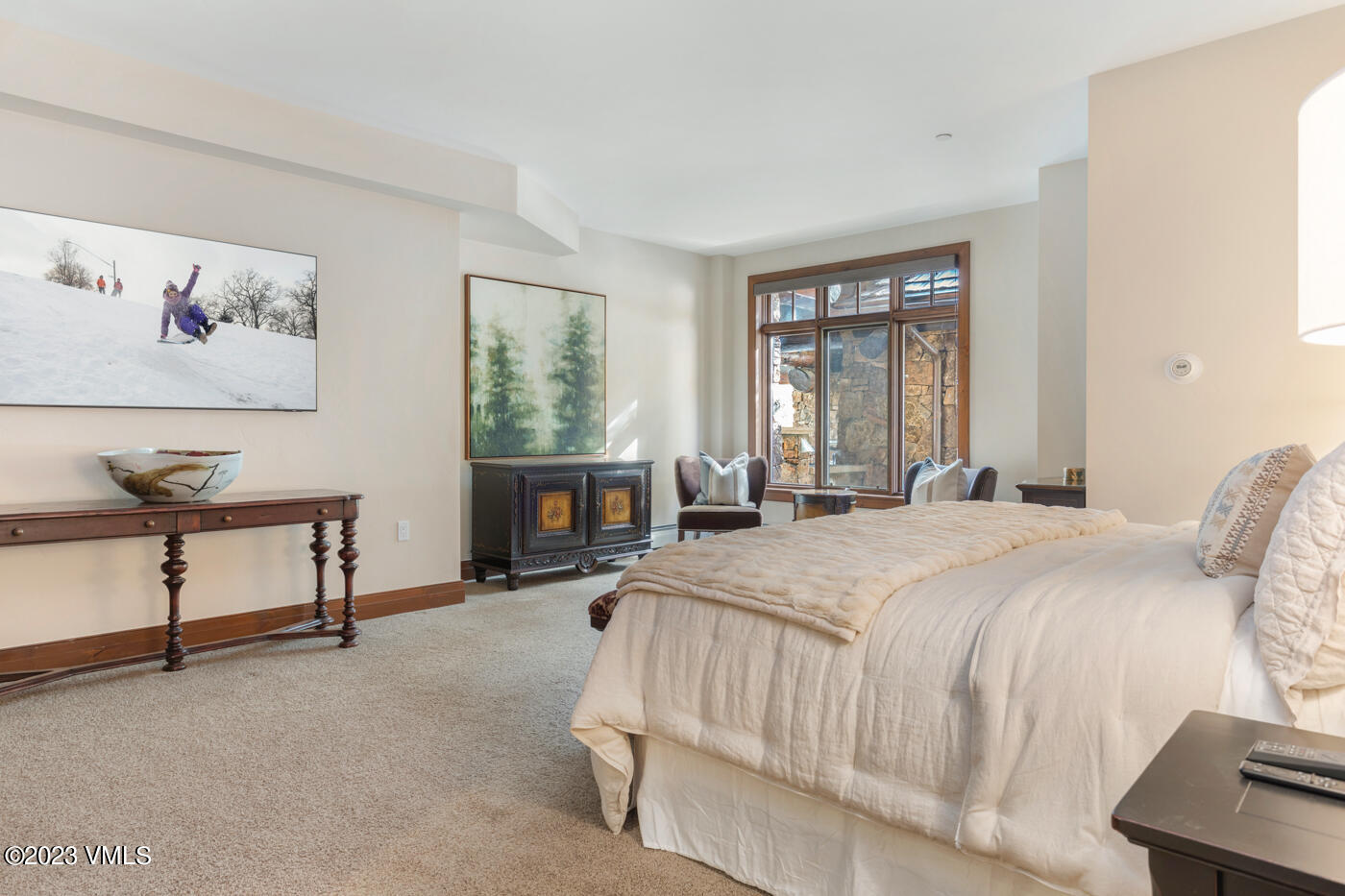 180 Daybreak Ridge Road, Unit 309 Avon, CO 81620 - Photo 18 of 27 a bedroom with a bed chair and window