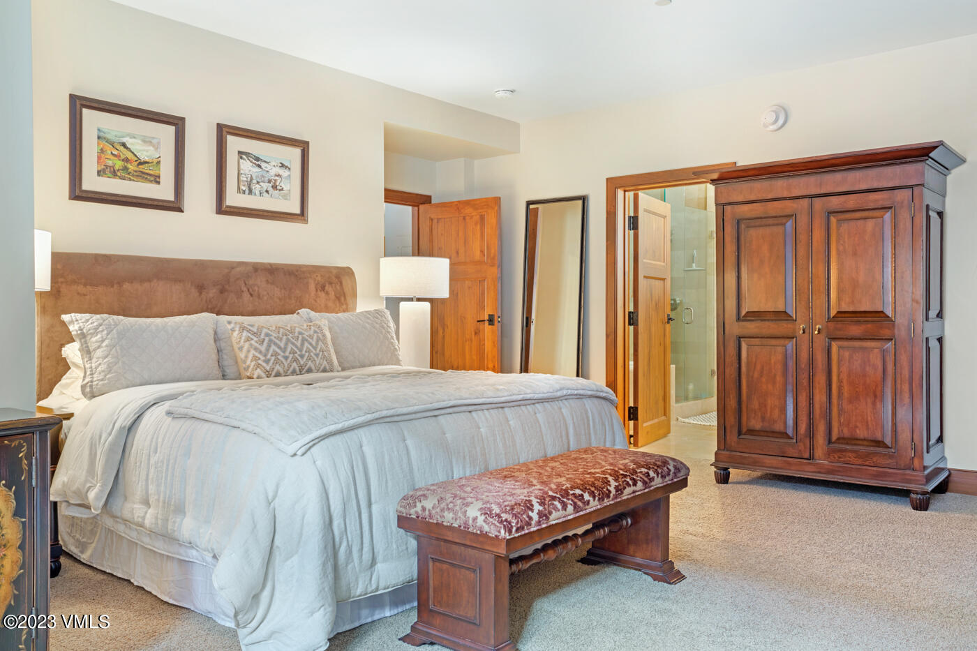 180 Daybreak Ridge Road, Unit 309 Avon, CO 81620 - Photo 19 of 27 a bedroom with a bed and a cabinets