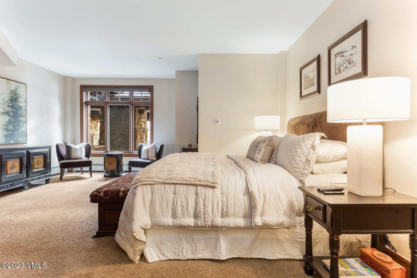 180 Daybreak Ridge Road, Unit 309 Avon, CO 81620 - Photo 20 of 27 a bedroom with a bed and lamp