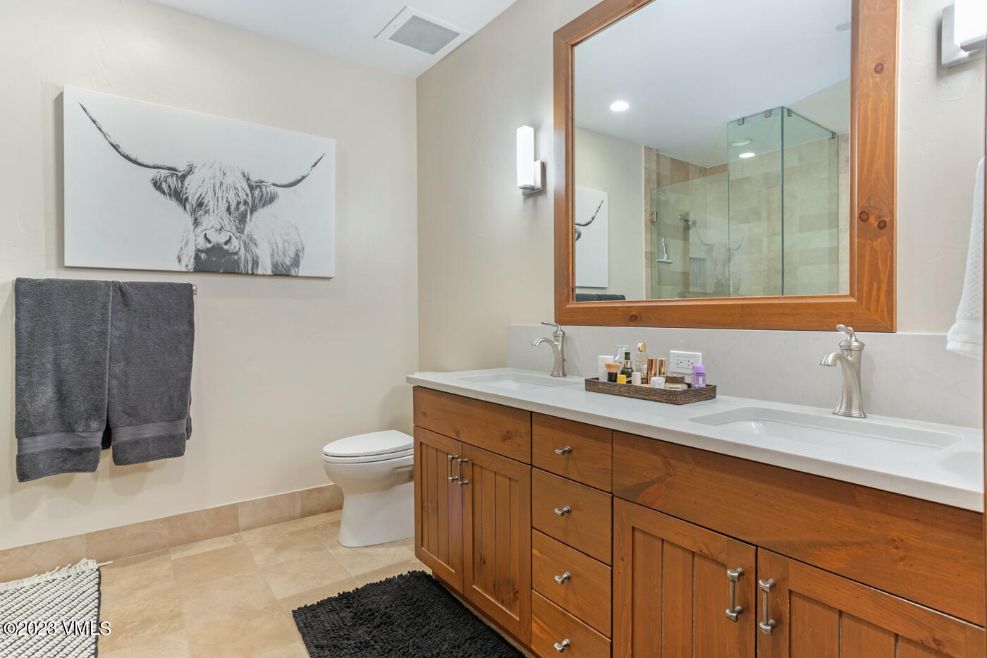180 Daybreak Ridge Road, Unit 309 Avon, CO 81620 - Photo 21 of 27 a bathroom with a toilet a sink and mirror