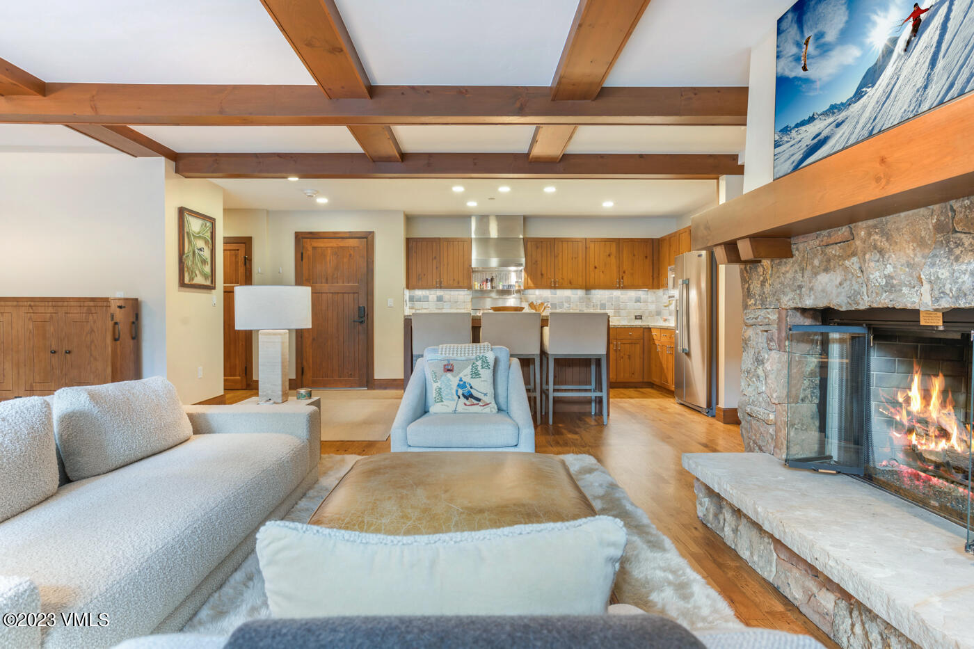 180 Daybreak Ridge Road, Unit 309 Avon, CO 81620 - Photo 6 of 27 a living room with furniture and a fireplace