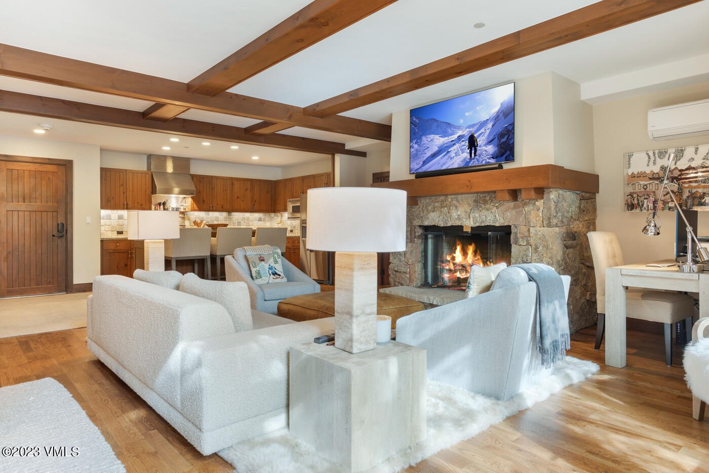 180 Daybreak Ridge Road, Unit 309 Avon, CO 81620 - Photo 7 of 27 a living room with furniture and a fireplace