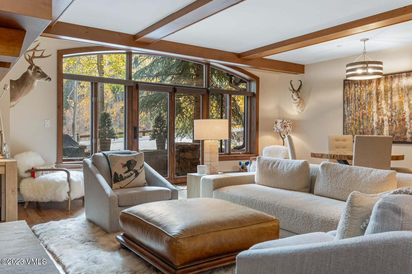180 Daybreak Ridge Road, Unit 309 Avon, CO 81620 - Photo 8 of 27 a living room with furniture and a large window