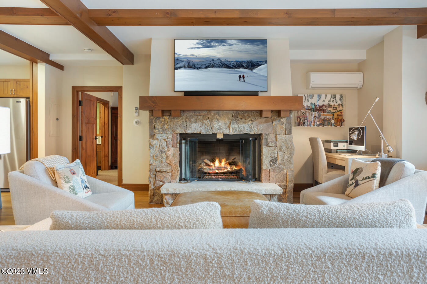 180 Daybreak Ridge Road, Unit 309 Avon, CO 81620 - Photo 10 of 27 a living room with furniture and a fireplace