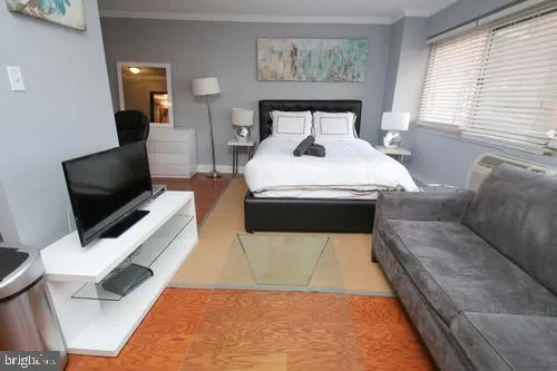 a living room with a couch and a flat screen tv