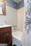 a bathroom with a sink and a bathtub