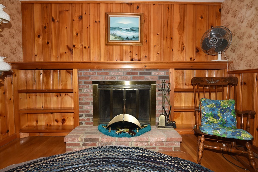 21 Whitehaven Way Dennis, MA 02660 - Photo 11 of 35 a close view of a fireplace in wooden floor